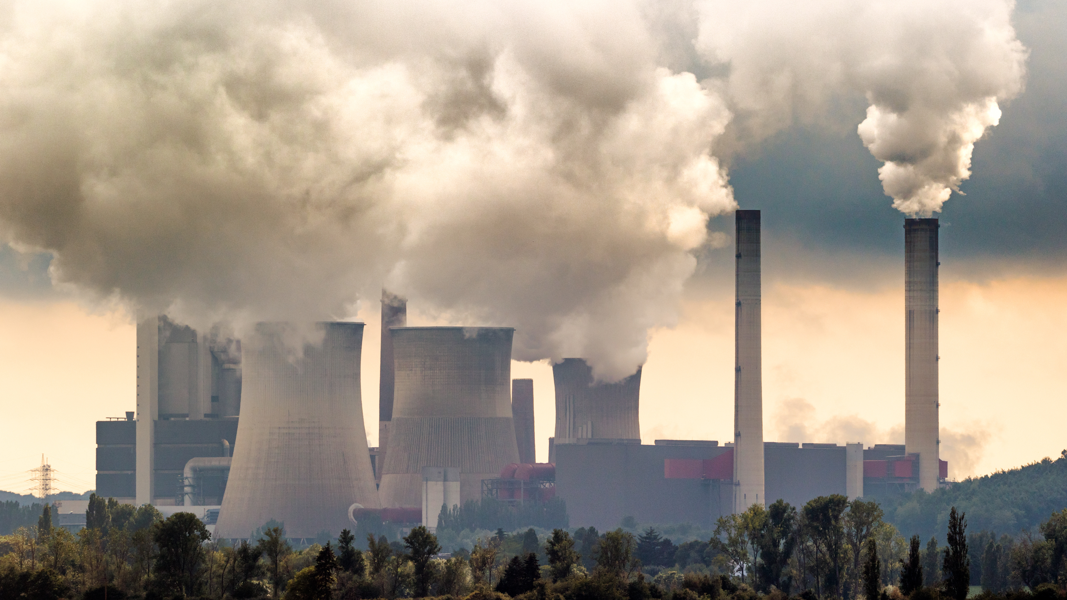 Large fossil fuel power plant station emission causing air pollution.